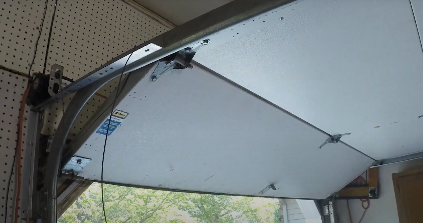 Expert technicians performing garage door track repair in Fort Pierce, Florida