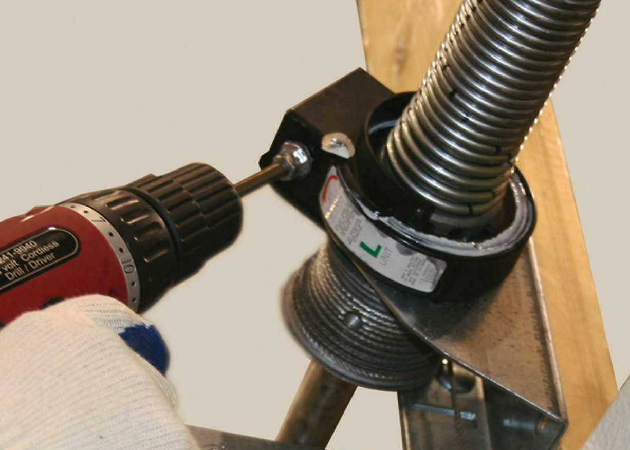 Expert fixing a noisy garage door in Fort Pierce, FL - Trusted Garage Door Repair Services for a quieter operation.