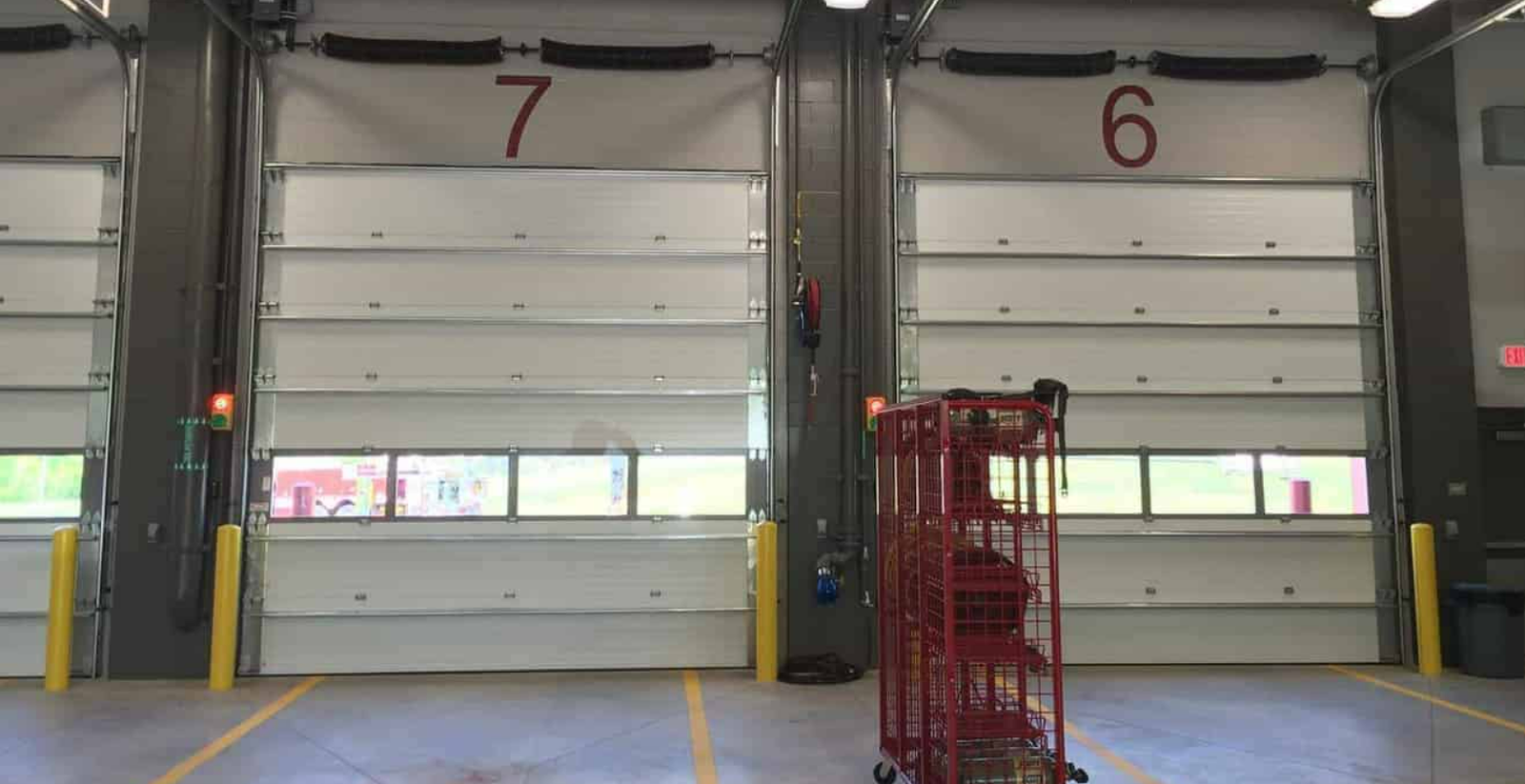 Professional garage door section replacement service in Fort Pierce, FL, showcasing expert repair work on a residential garage door for improved home security.